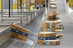 In this file photo, Amazon packages move along a conveyor at an Amazon warehouse facility in Goodyear, Arizona.