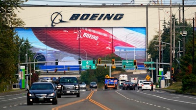 In this Oct. 1, 2020 file photo, traffic passes the Boeing airplane production plant, in Everett, Wash. U.S. manufacturers expanded in March 2021 at the fastest pace in 37 years, a sign of strengthening demand as the pandemic wanes and government emergency aid flows through the economy.