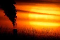 In this file photo, emissions from a coal-fired power plant are silhouetted against the setting sun in Independence, MO.