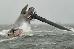 A Coast Guard Station Grand Isle 45-foot Respone Boat-Medium boatcrew heads toward a capsized 175-foot commercial lift boat Tuesday, April 13, 2021, searching for people in the water 8 miles south of Grand Isle, Louisiana.