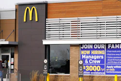In this Nov. 19, 2020, file photo, a hiring sign is displayed outside of McDonald's in Buffalo Grove, Ill. On Wednesday, April 14, 2021, McDonald’s said the company will mandate worker training to combat harassment, discrimination and violence in its restaurants worldwide starting in 2022.