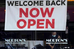 In this March 4, 2021, file photo, a sign reading 'Welcome Back Now Open' is posted on the window of a Morton's Steakhouse restaurant as a man works inside during the coronavirus pandemic in San Francisco. California added 141,000 jobs in February as more than a quarter of a million people returned to the workforce. The California Employment Development Department said Friday, March 26, that the state's unemployment rate in February was 8.5%, down from 9% in January.