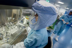 Vaccine production staff demonstrate operations at a facility in Germany.