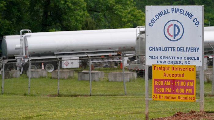 Tanker trucks are parked near the entrance of Colonial Pipeline Company in Charlotte, NC.
