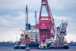Tugboats get into position on the Russian pipe-laying vessel 'Fortuna' in the port of Wismar, Germany, Jan. 14, 2021.