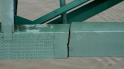 In this undated image released by the Tennessee Department of Transportation shows a crack is in a steel beam on the Interstate 40 bridge, near Memphis, Tenn. The Tennessee Department of Transportation says the crack is in a 900-foot steel beam that provides stability for the Interstate 40 bridge that connects Arkansas and Tennessee over the Mississippi River. The bridge was closed Tuesday, May 11, 2021 after inspectors found the crack.