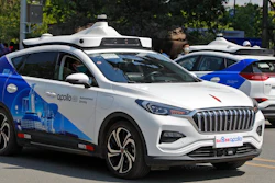 Baidu Apollo Robotaxis move on a street at the Shougang Park in Beijing, Sunday, May 2, 2021. Chinese tech giant Baidu rolled out its paid driverless taxi service on Sunday, making it the first company that commercialized autonomous driving operations in China.