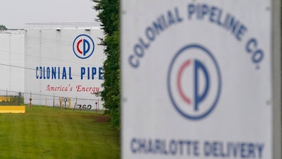 In this May 12, 2021, file photo, the entrance of Colonial Pipeline Company in Charlotte, N.C. U.S. pipeline operators will be required for the first time to conduct a cybersecurity assessment under a Biden administration directive to be issued Thursday in response to the ransomware hack that disrupted gas supplies in several states this month.
