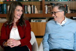 In this file photo, Bill and Melinda Gates smile at each other during an interview in Kirkland, Wash.