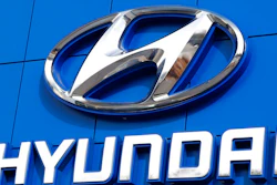 This July 26 2018 file photo shows the logo of Hyundai Motor Co. in Seoul, South Korea. Hyundai is recalling over 390,000 vehicles in the U.S. and Canada, Tuesday, May 4, 2021, for problems that can cause engine fires. In one recall, owners are being told to park outdoors until repairs are made. That recall covers more than 203,000 Santa Fe Sport SUVs from 2013 through 2015.