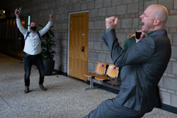 Milieudefensie director Donald Pols, right, celebrates the outcome of the verdict in the court case of Milieudefensie, the Dutch arm of the Friends of the Earth environmental organization, against Shell.