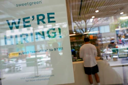 A signs announcing they are hiring hangs in the window of a restaurant in the Greenwich Village neighborhood of Manhattan in New York, Tuesday, May 4, 2021. Some restaurants in New York City are starting to hire employees now that they can increase their indoor dining to 75% of capacity starting May 7.