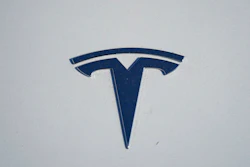 in this Sunday, Jan. 24, 2021, file photo, the company logo shines off the hood of an unsold 2021 Model 3 sedan at a Tesla dealership, in Littleton, Colo. Two key groups that offer automobile safety ratings have yanked their top endorsements of some Tesla vehicles because the company has stopped using radar on its safety systems.