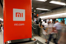 In this July 9, 2018, file photo, an advertisement for Xiaomi is displayed at a subway station in Hong Kong. China’s commerce ministry said Thursday that the removal of Xiaomi Corp. from a U.S. government blacklist was beneficial, a day after the U.S. reversed a ban on U.S. investments in the smartphone maker imposed by former President Donald Trump.