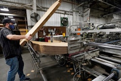 Rob Bondurant, a supervisor at Great Southern Industries, a packaging company, loads up a finishing machine in the Jackson, Miss., facility on May 28.