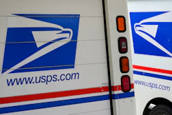 Mail delivery vehicles parked outside a post office in Boys Town, Neb., Aug. 18, 2020.