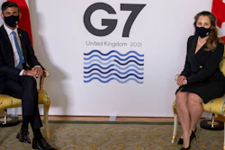 Britain's Chancellor of the Exchequer Rishi Sunak, left, sits with Canada's Finance Minister Chrystia Freeland, ahead of the G7 finance ministers meeting at Lancaster House in London, Friday June 4, 2021.