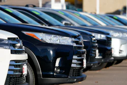 This Nov. 15, 2020 photo shows a long row of unsold used Highlander sports-utility vehicles sits at a Toyota dealership in Englewood, Colo. In 2021, high demand and low supply have driven up used vehicle prices so much that many are now selling for more than their original sticker price when they were new.