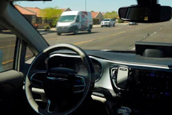 In this April 7, 2021 file photo, a Waymo minivan moves along a city street as an empty driver's seat and a moving steering wheel drive passengers during an autonomous vehicle ride in Chandler, Ariz. The U.S. government's highway safety agency has ordered automakers to report any crashes involving fully autonomous vehicles or partially automated driver assist systems. The move Tuesday, June 29, by the National Highway Traffic Safety Administration indicates the agency is taking a tougher stance on automated vehicle safety than in the past.