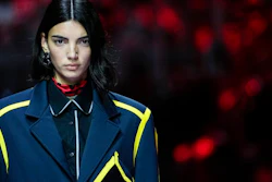 A model wears a creation as part of the Ferrari women's and men's Spring Summer 2022 collection, in Maranello, Italy, Sunday, June 13, 2021.