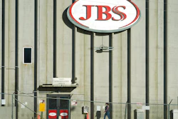 In this Oct. 12, 2020 photo, a worker heads into the JBS meatpacking plant in Greeley, Colo.