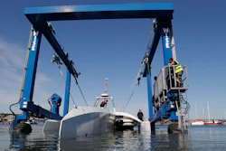 In this Monday, Sept. 14, 2020 file photo, technicians lower the Mayflower Autonomous Ship into the water at its launch site for it's first outing on water since being built in Turnchapel, Plymouth south west England.