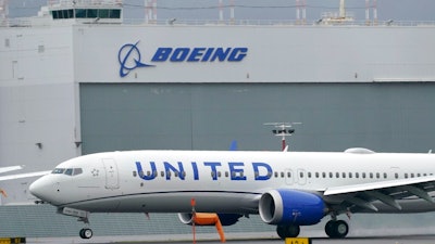 This Nov. 18, 2020, file photo shows a Boeing 737 Max 9 built for United Airlines landing at King County International Airport - Boeing Field after a test flight from Moses Lake, Wash., in Seattle. United Airlines is placing a huge order for new planes so it can replace aging ones and prepare for growth as the pandemic subsides. United said Tuesday, June 29, 2021, that it will order 200 Boeing Max jets and 70 Airbus planes.