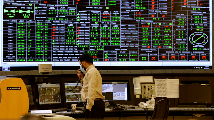 A Saudi Aramco engineer monitors the central control room of the Khurais oil field east-northeast of Riyadh, June 28, 2021.