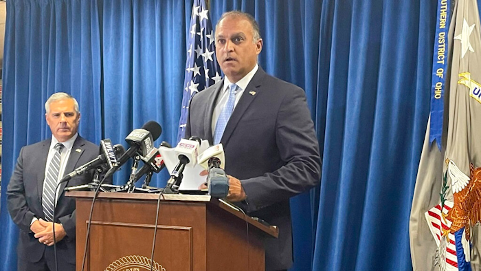 Acting U.S. Attorney Vipal J. Patel, center, accompanied by FBI Special Agent in Charge Chris Hoffman, speaks during a news conference in Cincinnati, Thursday, July 22, 2021. Federal authorities say Akron-based FirstEnergy Corp. would pay a $230 million penalty and fully cooperate as part of an agreement announced Thursday to settle federal charges against the company in a sweeping bribery scheme in Ohio.