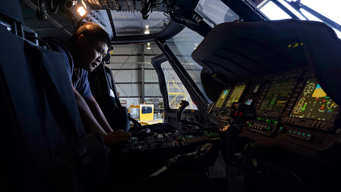 Avionics mechanic Mike Luong inspects the control panel of Sikorsky Firehawk helicopter at the California Department of Forestry and Fire Protection's Sacramento Aviation Management Unit based at McClellan Airpark in Sacramento, Calif., Friday, July 23, 2021.