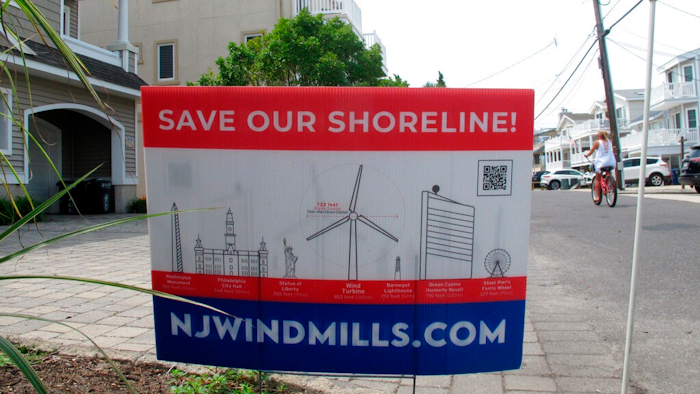This July 8, 2021 photo shows a sign in Ocean City, N.J. urging opposition to offshore wind projects.