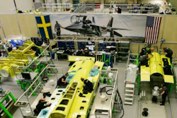 Saab employees work on an aft airframe section for the T-7A Red Hawk trainer for the United States Air Force.