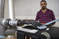 Researchers used individual fingertips fitted with stretchable tactile sensors with liquid metal on a prosthesis attached to a robotic arm.