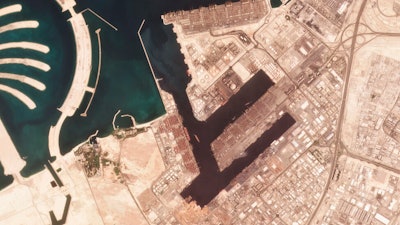 In this satellite photo shot by Planet Labs Inc., the Jebel Ali Port is seen early Wednesday, July 7, 2021, in Dubai, United Arab Emirates. A fiery explosion erupted on a container ship anchored in Dubai at one of the world's largest ports later Wednesday, authorities said, sending tremors across the commercial hub of the United Arab Emirates.