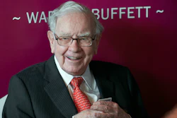 In this May 5, 2019, file photo Warren Buffett, Chairman and CEO of Berkshire Hathaway, smiles as he plays bridge following the annual Berkshire Hathaway shareholders meeting in Omaha, Neb.