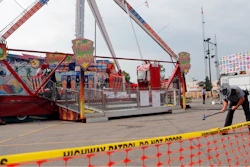 In this July 27, 2017 file photo, an Ohio State Highway Patrol trooper removes a ground spike in front of the Fire Ball ride at the Ohio State Fair, in Columbus, Ohio. Ohio has beefed up its amusement ride inspections four years after the ride broke apart at the 2017 Ohio State Fair and killed a high school student and injured several others. But some ride operators and festival organizers say the state's inspectors are overreaching and shutting down rides over issues that aren't safety-related.