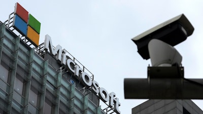 A security surveillance camera is seen near the Microsoft office building in Beijing, Tuesday, July 20, 2021. The Biden administration and Western allies formally blamed China on Monday for a massive hack of Microsoft Exchange email server software and asserted that criminal hackers associated with the Chinese government have carried out ransomware and other illicit cyber operations.