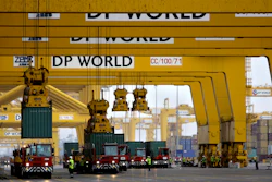 In this Feb. 8, 2009 file photo, cranes off load containers at the Jebel Ali port terminal 2, in Dubai, United Arab Emirates.