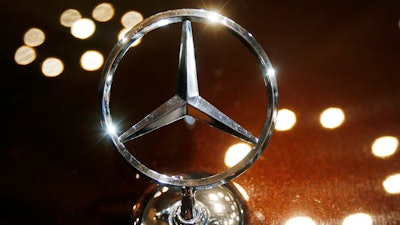 In this Feb. 5, 2015 file photo the logo of a Mercedes car is photographed during an annual press conference of Daimler AG in Stuttgart, Germany.