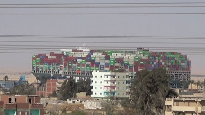 In this grab taken from file video, a view of huge container ship, Ever Given on the Suez Canal. The huge container ship that blocked the Suez Canal for nearly a week earlier this year has finally reached the port of Rotterdam to begin unloading its cargo.