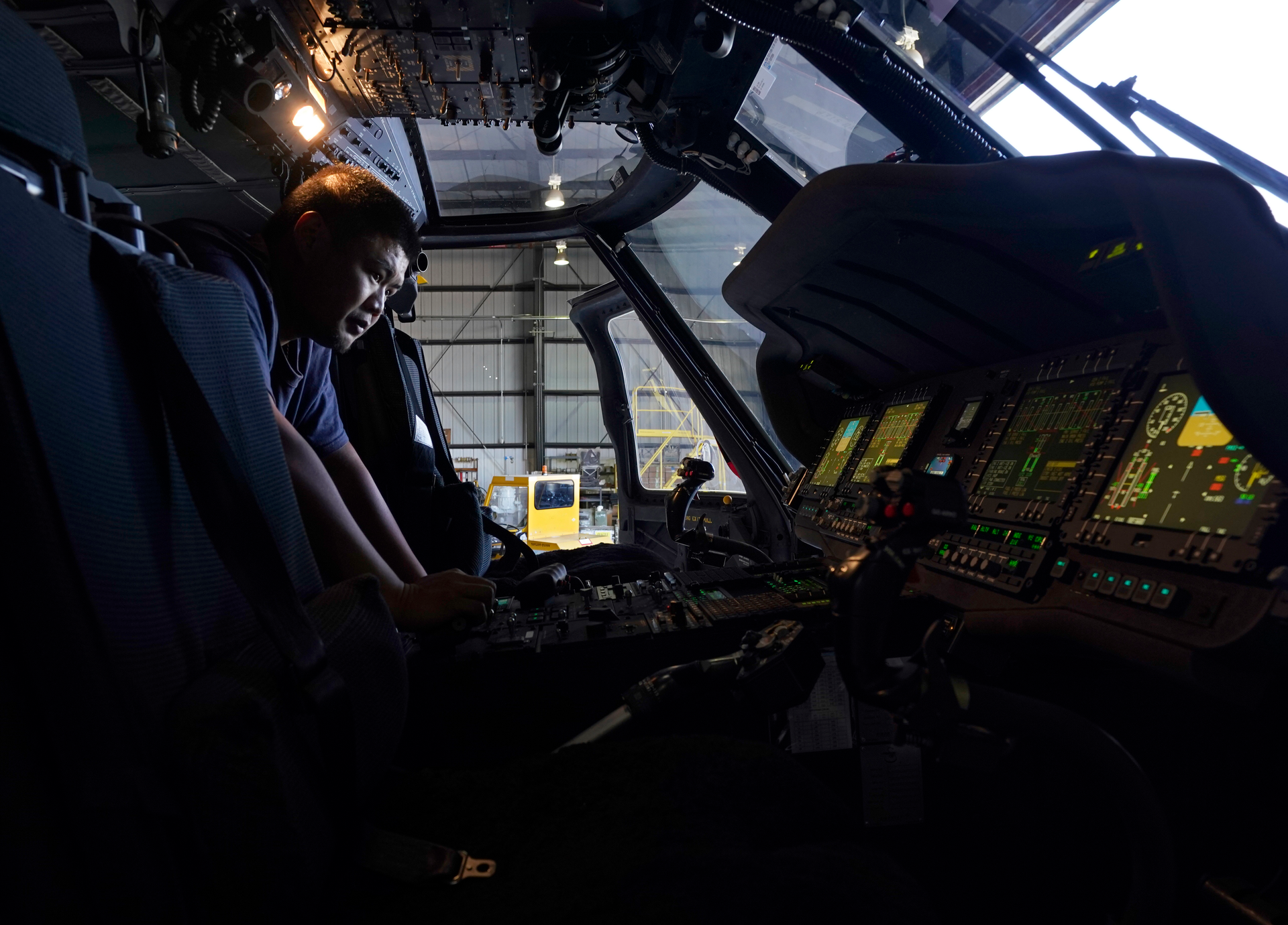 Avionics mechanic Mike Luong inspects the control panel of Sikorsky Firehawk helicopter at the California Department of Forestry and Fire Protection's Sacramento Aviation Management Unit based at McClellan Airpark in Sacramento, Calif., Friday, July 23, 2021.