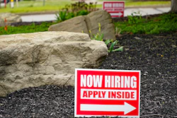 Hiring signs posted outside a gas station in Cranberry Township, Pa., May 5, 2021.