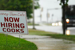 A hiring sign is shown in Downers Grove, Ill., Thursday, June 24, 2021. The number of Americans collecting unemployment benefits slid last week, another sign that the job market continues to recover rapidly from the coronavirus recession.Jobless claims dropped by 24,000 to 400,000 last week, the Labor Department reported Thursday, July 29, 2021.