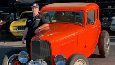 Cole Kleis standing next to a 1932 Ford Coup in front of a garage in Napa, Calif., August 2020.
