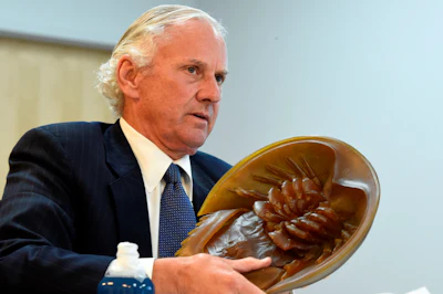 South Carolina Gov. Henry McMaster holds a model of a horseshoe crab, whose blood is a vital component in the contamination testing of injectable medicines - including the coronavirus vaccines - at Charles River Labs on Friday, Aug. 6, 2021, in Charleston, S.C.