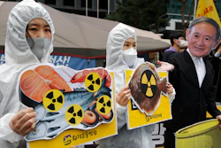 Activists protest the Japanese government's decision to release treated radioactive water, near the Japanese Embassy in Seoul, April 13, 2021.