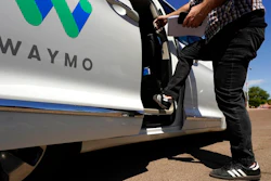 A Waymo minivan arrives to pick up passengers, Mesa, Ariz., April 7, 2021.
