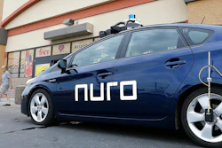 A self-driving Nuro vehicle parks outside a Fry's supermarket, Scottsdale, Ariz., Aug. 16, 2018.
