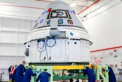 In this June 2, 2021 photo made available by NASA, technicians prepare Boeing's CST-100 Starliner for the company's Orbital Flight Test-2 (OFT-2) in the Commercial Crew and Cargo Processing Facility at NASA's Kennedy Space Center in Florida. On Friday, Aug. 13, 2021, Boeing and NASA officials said the capsule is grounded for months and possibly even until next year because of a vexing valve problem.