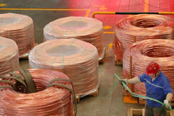 A man works at a factory producing power grid equipment and cable in Nantong city in east China's Jiangsu province Tuesday, July 27, 2021. China's manufacturing growth in July slowed to its lowest level in 15 months as export demand weakened and factories coped with disruptions in supplies of raw materials and components, two surveys found.